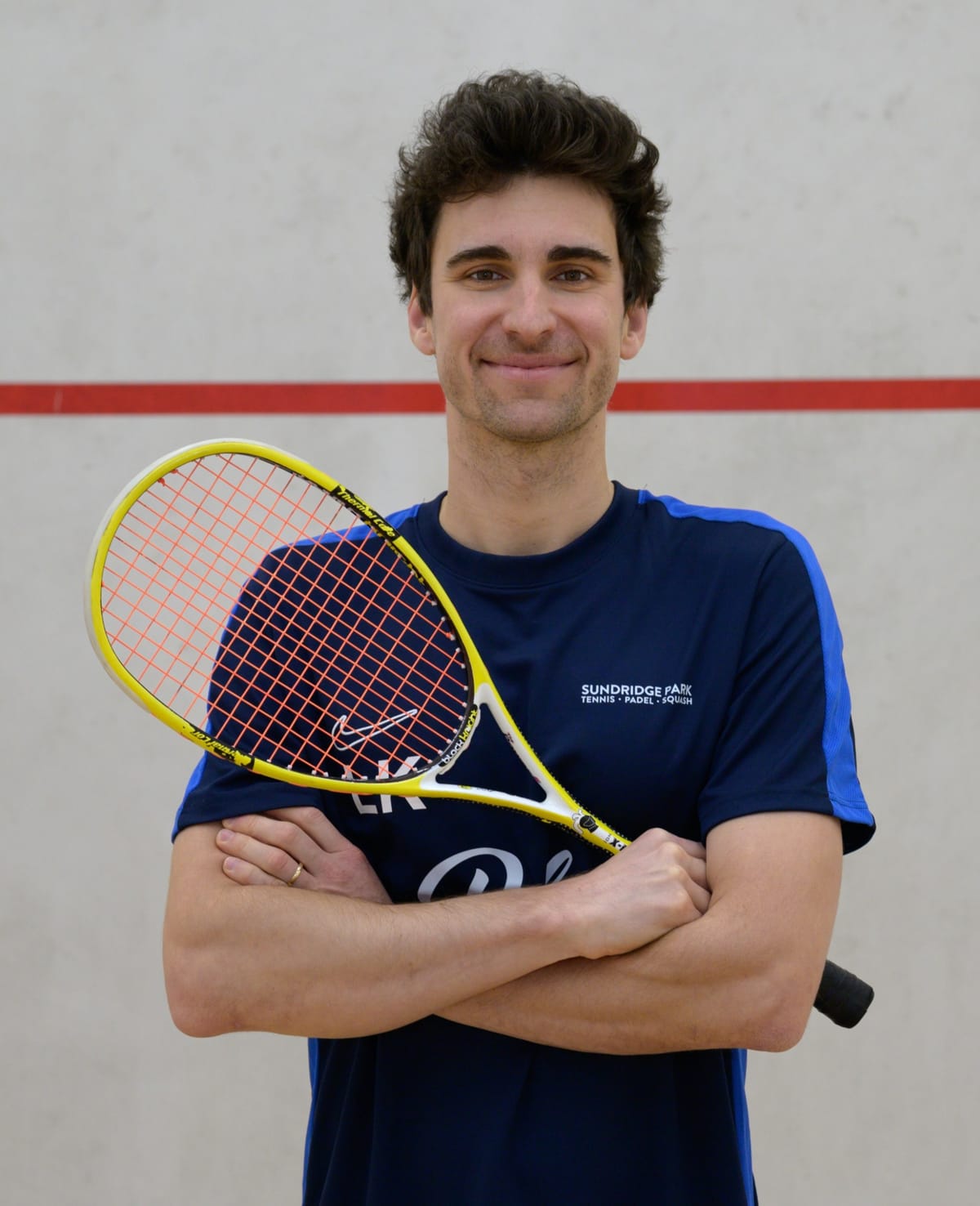 A picture of Lukasz Kondratowicz, a squash coach in Singapore
